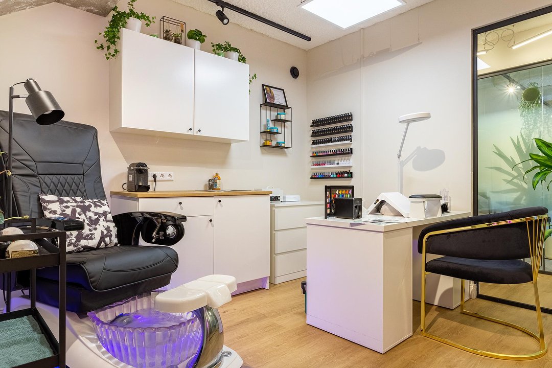 Hello Nails by Kate salon, with manicure stations and pedicure chairs inside Gallery Salon Studios